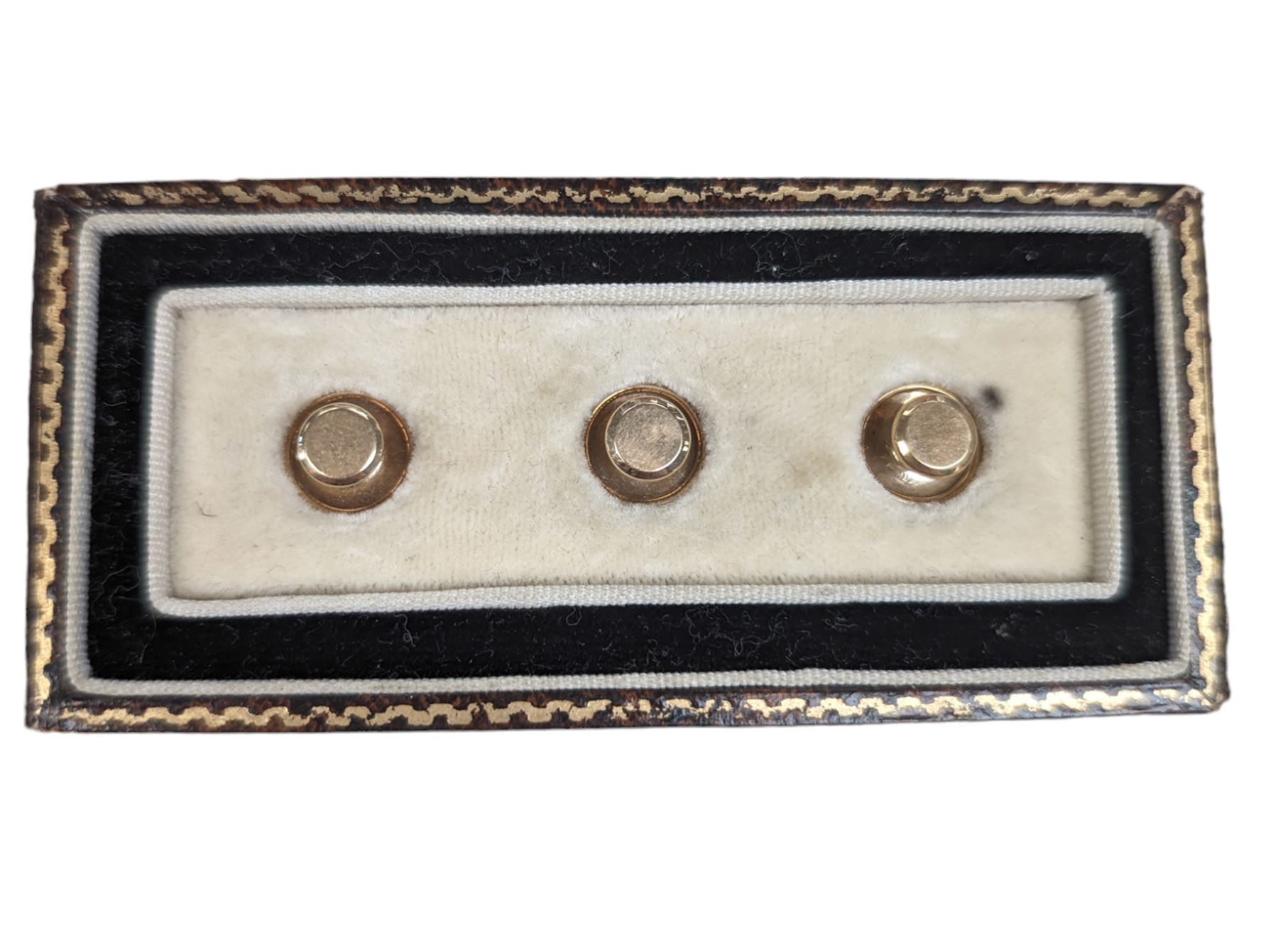 Cased set of three 9ct gold shirt studs