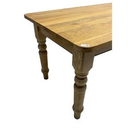 Limed oak dining table, rectangular top with rounded corners, on turned supports