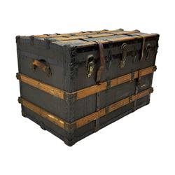 Early 20th century 'McBrine Baggage' steamer trunk, oak frame and black canvas covering, featuring metal hardware and leather straps, fitted with central lock, additional latches, and corner protectors, the interior is lined with floral-patterned paper and includes a removable top tray with makers label 