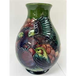 Moorcroft vase of baluster decorated in the Finches pattern with green ground, designed by Sally Tuffin, with makers mark beneath, H20cm