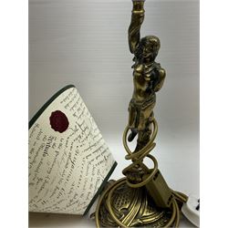 Gilt metal table lamp, modelled as a classical female figure holding the shade aloft in one hand, upon a spreading base, including shade H51cm