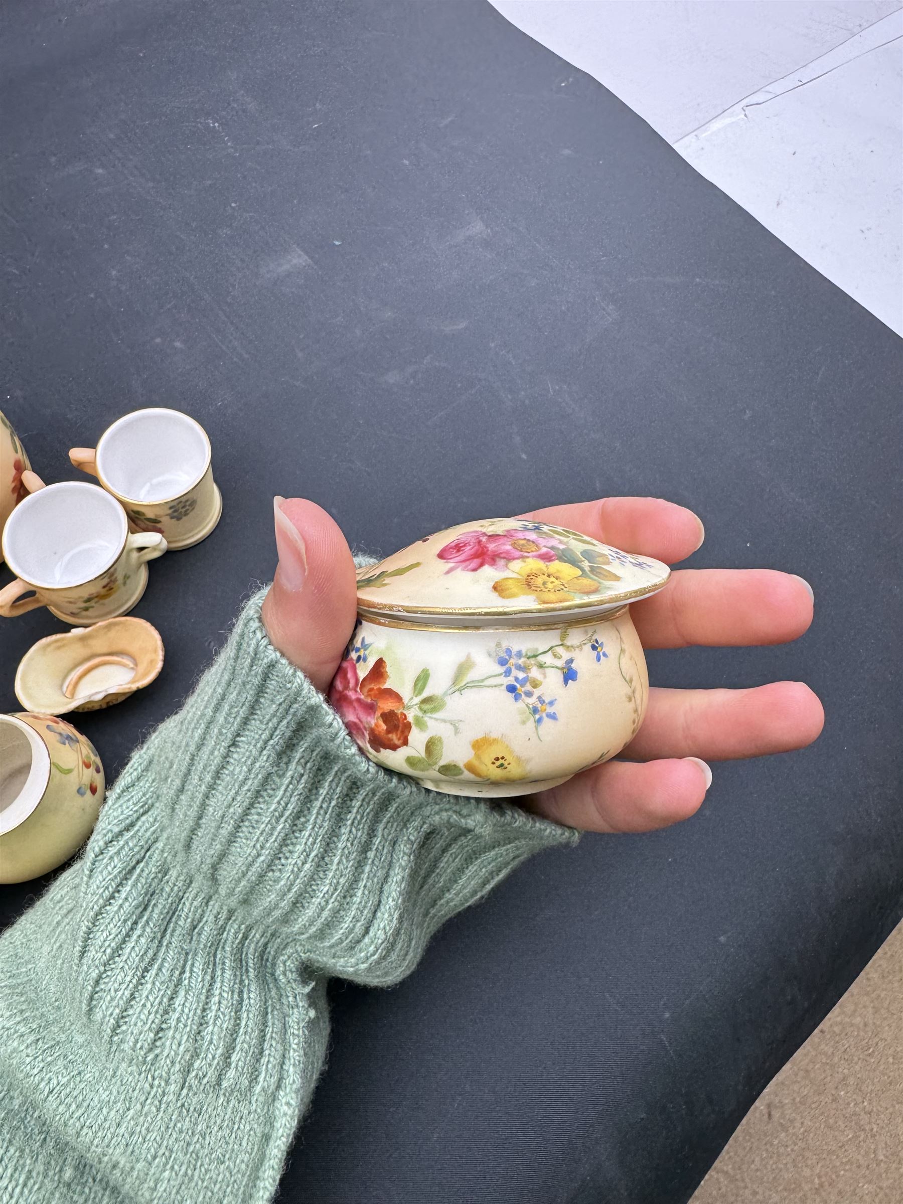 Collection of Royal Worcester blush ivory ceramics, including a graduating set of posey baskets, miniature flatback jug, covered jars etc (19) 