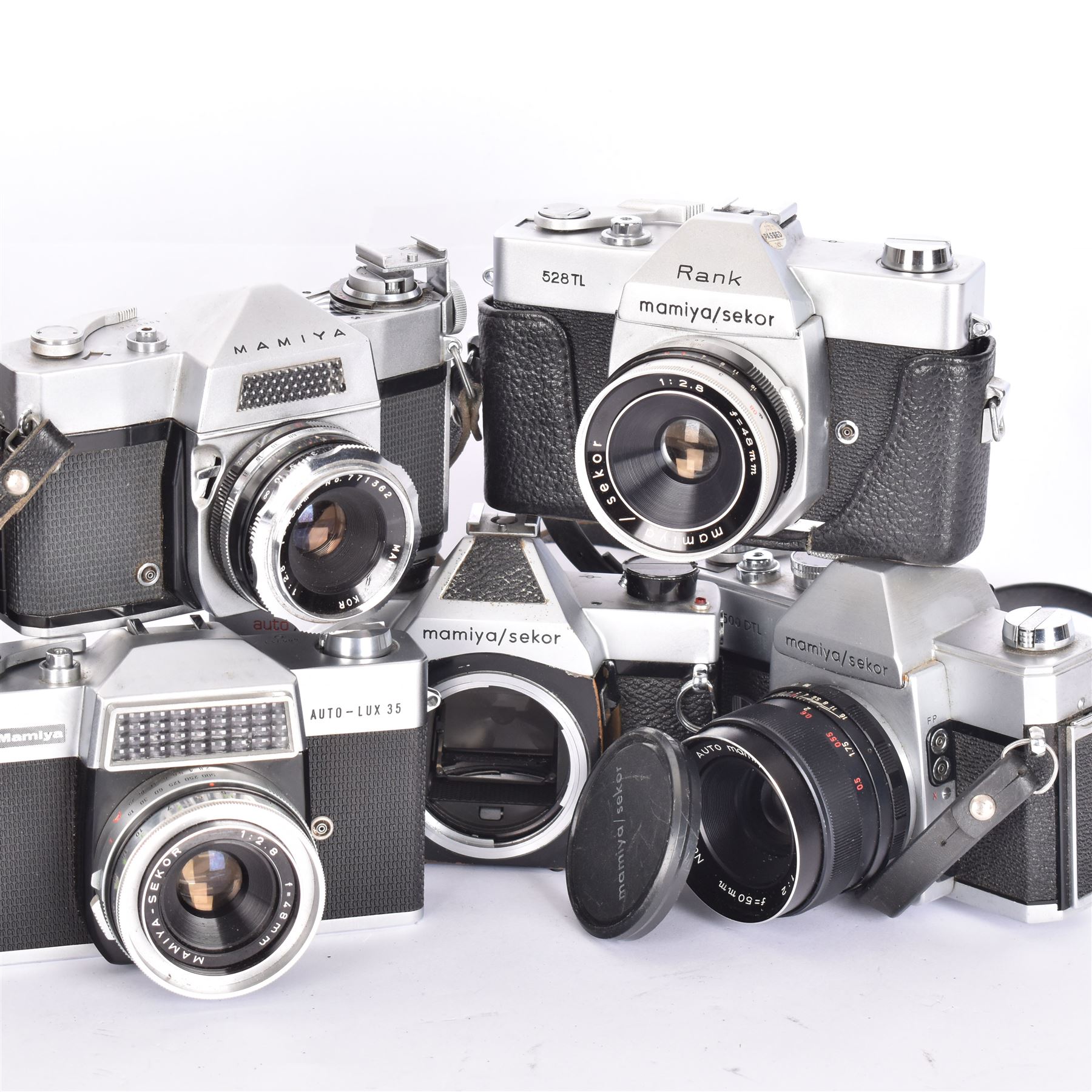 Five Mamiya/Sekor SLR camera bodies, to include autoXTL serial no. PI34456, with a ES 1:18 f=55mm serial no. 28148, Rank 528TL camera body serial no. 18151, with a 1:2.8 f=48mm lens, Rank Mamiya Auto-Lux 35 camera body serial no. 644713, with a 1:2.8 f=48mm lens, 500DTL serial no. 386357, with an Auto 1:2 f=50mm lens serial no. 187863, and one other 