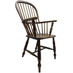 Early 19th century elm Windsor chair, high hoop and stick back over shaped saddle seat, raised on ring turned supports united by H-stretcher