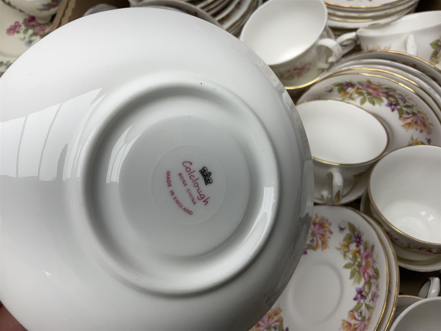 Royal Staffordshire Dinnerware by Clarice Cliff Nancy pattern dinner wares, including sauce boat, dinner plates, side plate and serving platter, together with a collection of Colclough Wayside Honeysuckle pattern tea wares