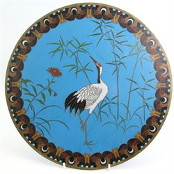 Chinese cloisonne plate, centrally decorated with birds perched on a blossoming tree, D30.5cm, a similar circular wall plaque, decorated with a Crane, together with a pair of Cloisonne green ground vases (4)