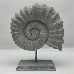 Composite Ammonite, raised on a wooden stepped plinth, H36cm