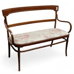 Early 20th century beech framed and bentwood bench, shaped cresting rail over rolled arms, upholstered seat in floral pattern fabric, on turned supports