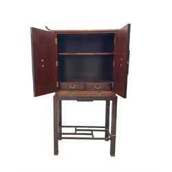 Chinese design bamboo and wood altar cabinet on stand, parquetry lattice-work bamboo, two doors with engraved metal fixtures enclosing drawers and shelf, fitted with slide, the stand pm square supports joined by a series of geometric stretchers