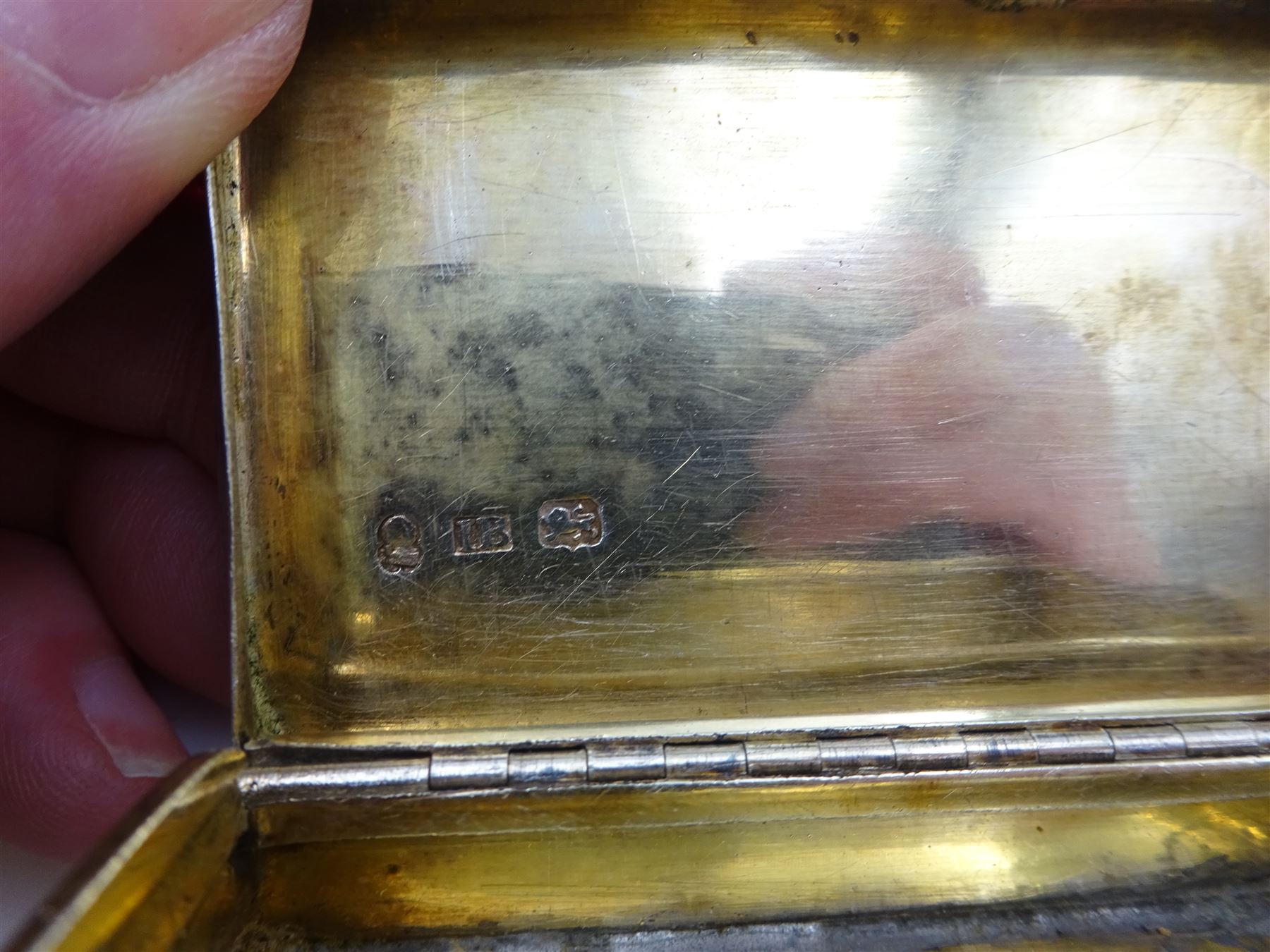 George IV silver snuff box, of rectangular form, with engine turned decoration, chased foliate borders and blank cartouche to centre of hinged cover, opening to reveal a gilt interior, hallmarked John Bettridge, Birmingham 1825, W7.6cm