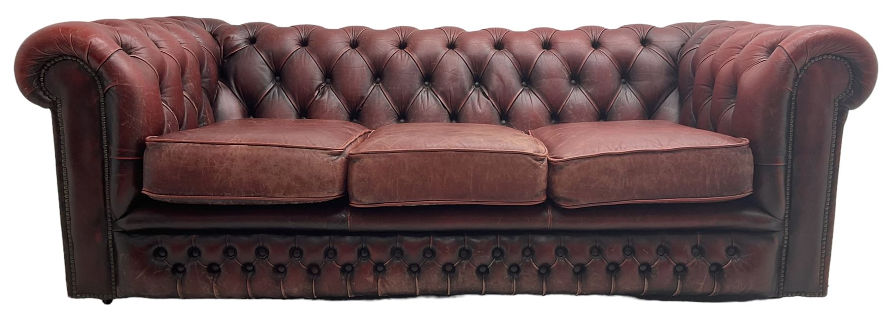 Chesterfield three-seat sofa upholstered in red buttoned leather