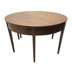 Regency mahogany D-ended extending dining table, circular top with banded fireze inlaid with ebony stringing, raised on square tapering supports, with two additional leaves, supported by gate-leg central action