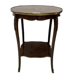 Early 20th century French two-tier marquetry inlaid walnut side table, shaped circular top with gilt metal edge, central chequered inlaid circular panel with floral motif, raised on cabriole supports with gilt metal mounts, united  by undertier