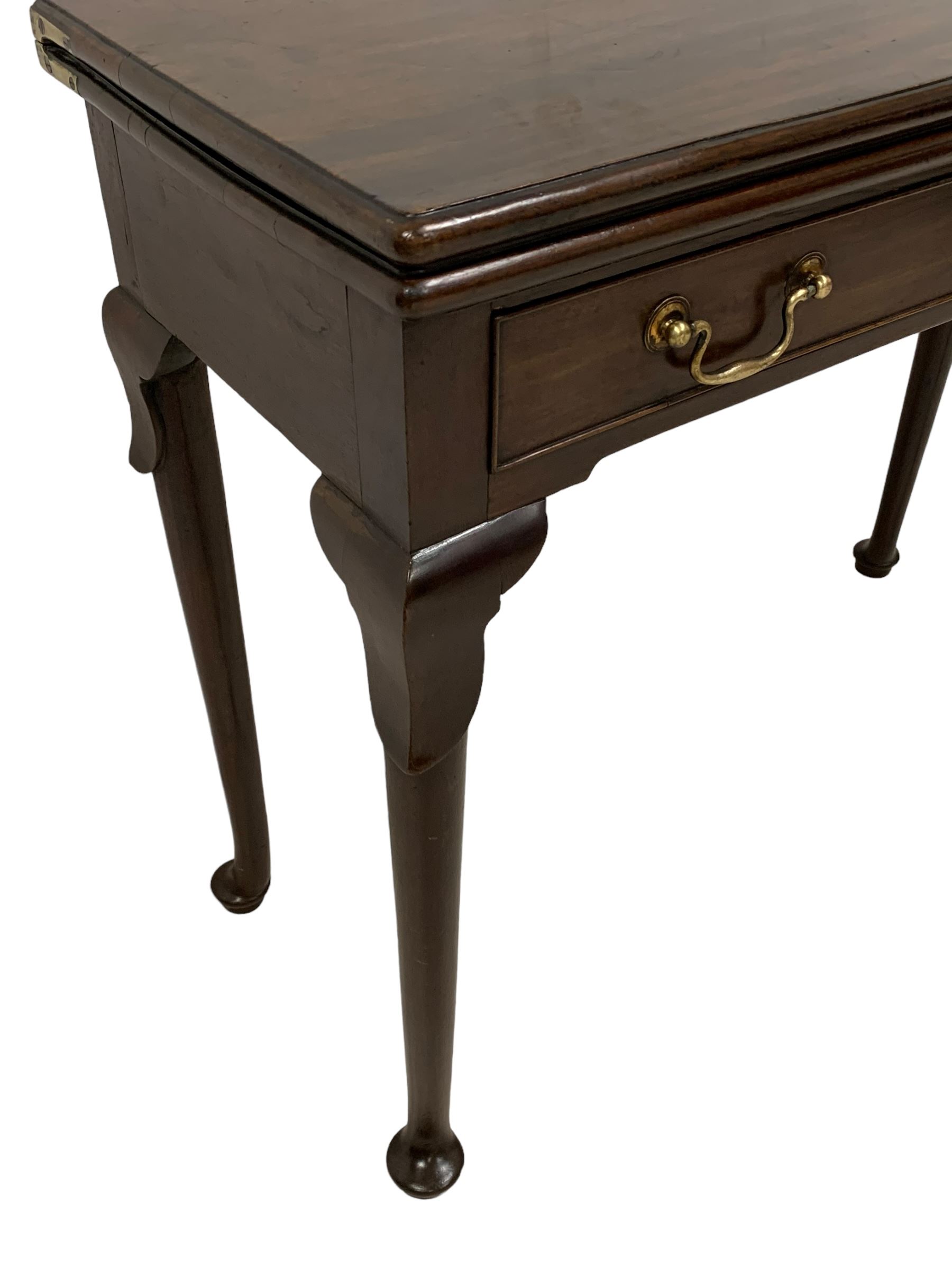 George III mahogany card table, moulded rectangular fold-over top revealing baize lined interior, single cocked-beaded frieze drawer with brass swan neck handles, on lappet carved cabriole supports, double gate-leg action base 