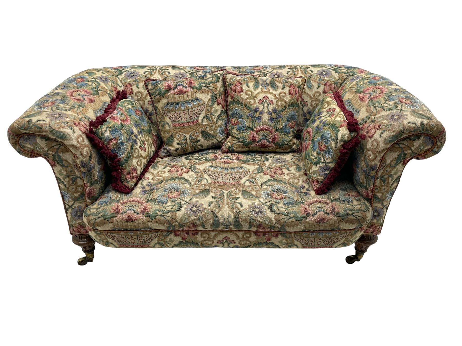 Mid-19th century walnut framed two-seat sofa, rolled arms over sprung seat, single drop-end action, raised on turned and fluted feet with brass cups and castors, upholstered by E & S Gott in traditional floral pattern fabric decorated with urns