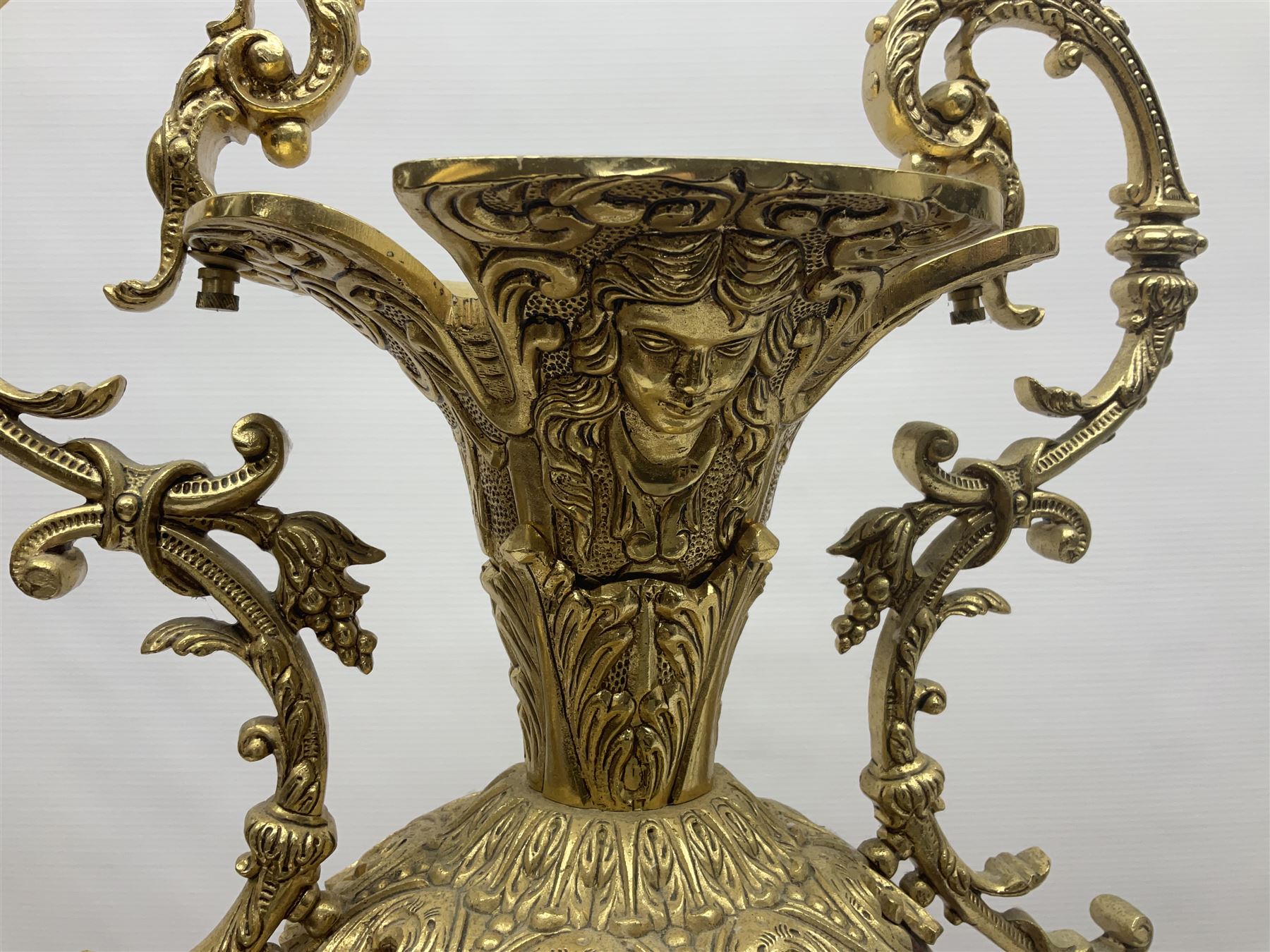 Twin handled vase, the ceramic urn form body decorated with floral sprigs and figural panel, the metal handles designed as vines, together with a similar ewer, vase H75cm 