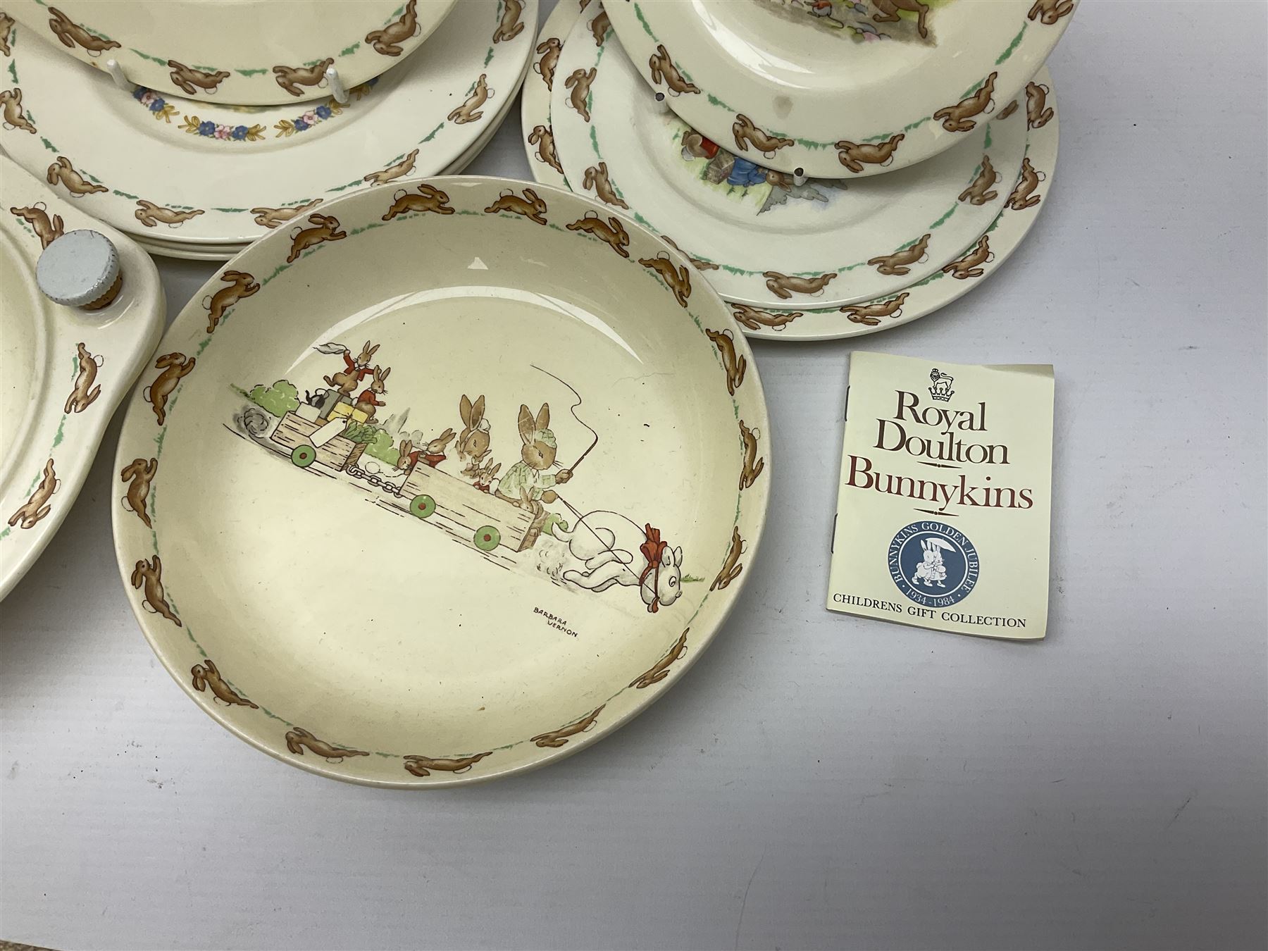 Royal Doulton Bunnykins nursery wares, including twin handled mugs, bowls, plates (17) 