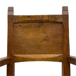 Gnomeman - set of eight (6+2) oak dining chairs, adzed panelled back over tan leather upholstered seat with applied stud band, on square supports united by plain stretchers, each chair carved with gnome signature, by Thomas Whittaker, Littlebeck, Whitby