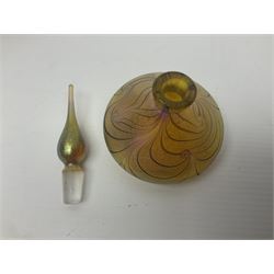 Four Okra scent bottles, the first example modelled as an apple, the second of squat form decorated with iridescent threads upon a gold ground and two others 