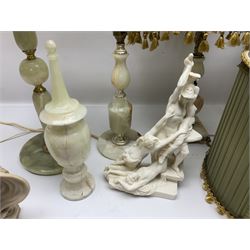 Onyx table lamp, with knopped stem and cream and green tassel shade, together with three smaller similar onyx lamps, classical style alabaster figures and a covered onyx jar