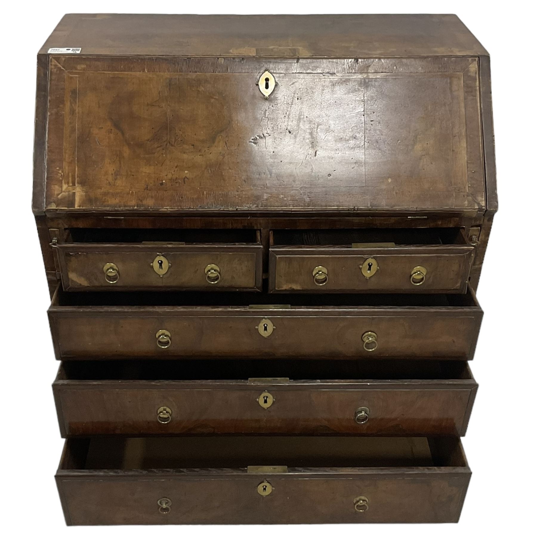 18th century walnut bureau, crossbanded and feather-banded rectangular top and fall-front, enclosing fitted interior with pigeonholes and correspondence drawers with bone handles, over two short and three long graduating drawers with moulded facias and original brass handles, on bracket feet