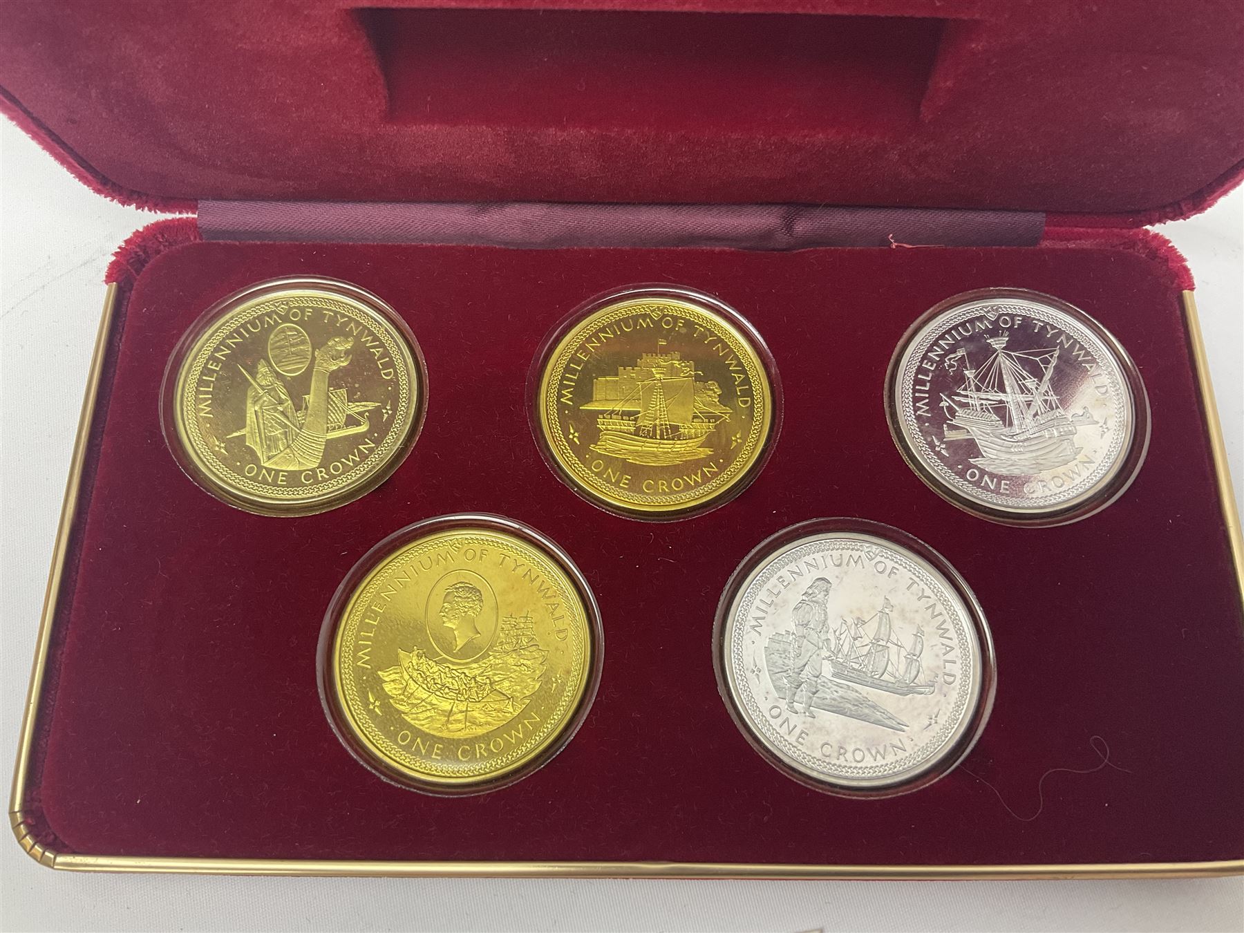 Queen Elizabeth II Isle of Man 1980 'Commemorating the 1980 Olympics' silver proof crown four coin set and 1979 '1000th Anniversary of Tynwald' silver proof crown five coin set, both sets cased with certificates 