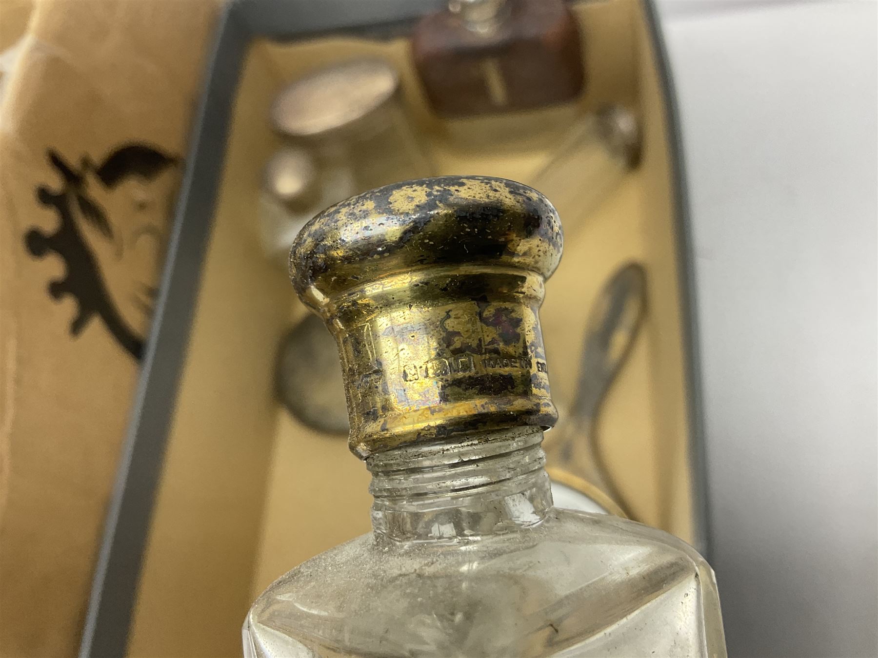 Silver mounted hand mirror and glass vanity bottles/jars with silver caps, all hallmarked, together with silver plated teapot, serving dishes and glass hip flask