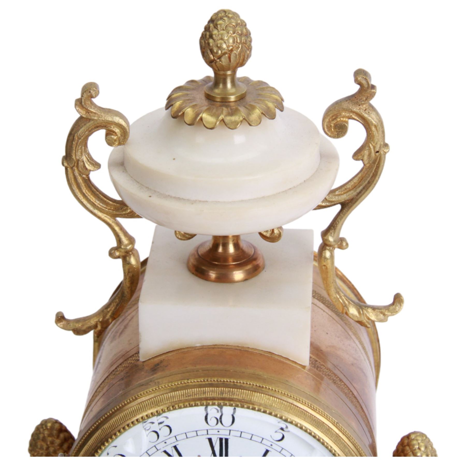 French - Louis XV style white marble and gilt mounted 8-day portico clock garniture c1905, drum movement surmounted by an oval shaped urn, supported on a pair of tapered column supports and raised on a rectangular plinth base, white enamel dial with floral garlands and Arabic numerals, Louis XV style gilt hands within a glazed bezel, twin train countwheel striking movement, striking the hours and half hours on a bell, with a pair of conforming three light candelabra, decorative matching pendulum and key.