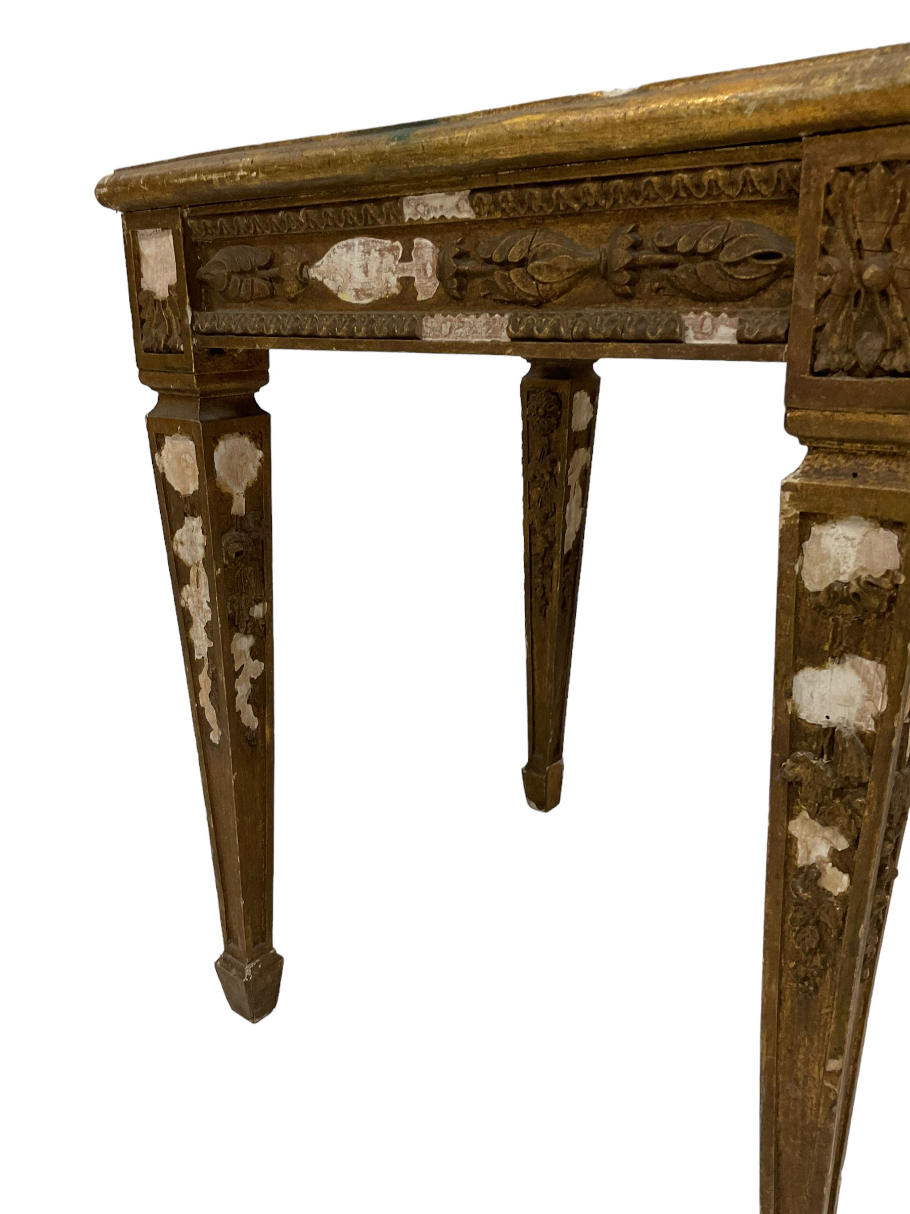 Pair of 20th century giltwood and gesso vase or lamp side table, the moulded square top with circular central recess, decorated with applied foliage and flower head mouldings, on square tapering supports with spade feet