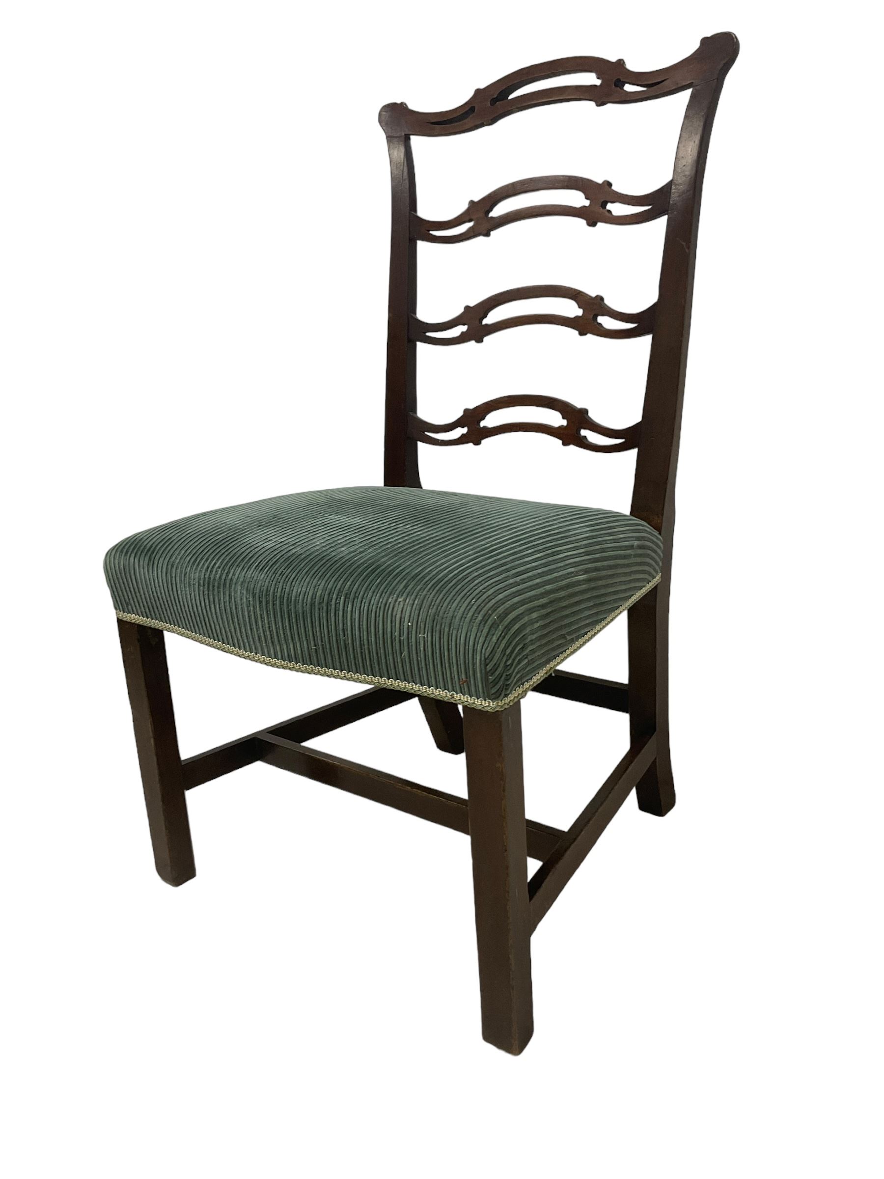 Set of twelve (10+2) Chippendale revival stained beech dining chairs, pierced waived ladder backs with over-stuffed over seats, on square moulded supports joined by stretchers