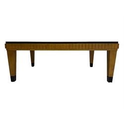 Art Deco design maple wood coffee table, rectangular top with reeded edge, on tapered supports with metal feet protectors