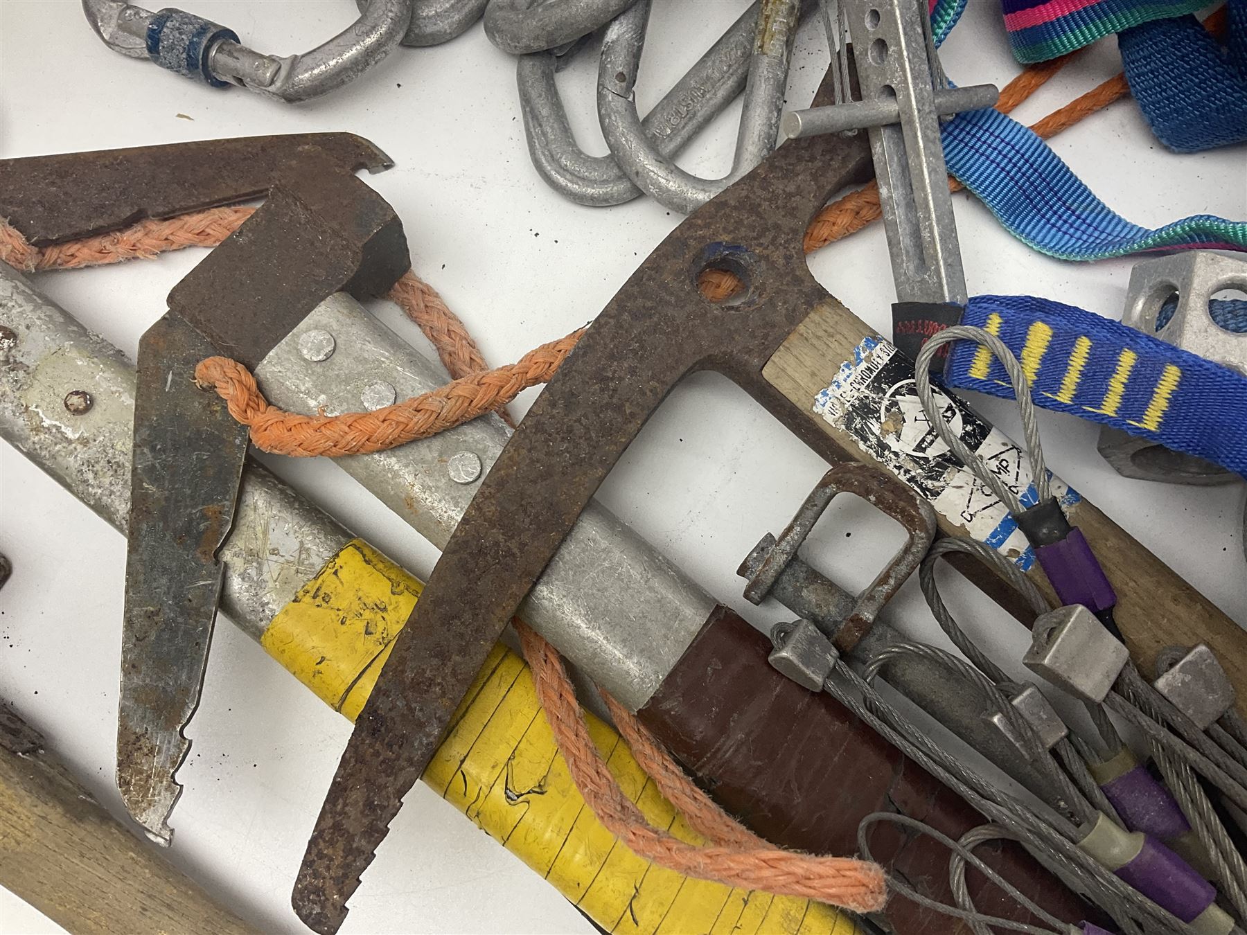 Collection of 1960s/70s climbing equipment including two original Hamish McInnes Pterodactyl ice axes, Joe Brown helmet, carabiners, ropes and wires etc