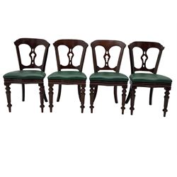 Matched set of twelve Victorian mahogany dining or boardroom chairs, the shaped cresting rail decorated with scrolled decoration, upholstered drop-on seats upholstered in green fabric, on turned supports  