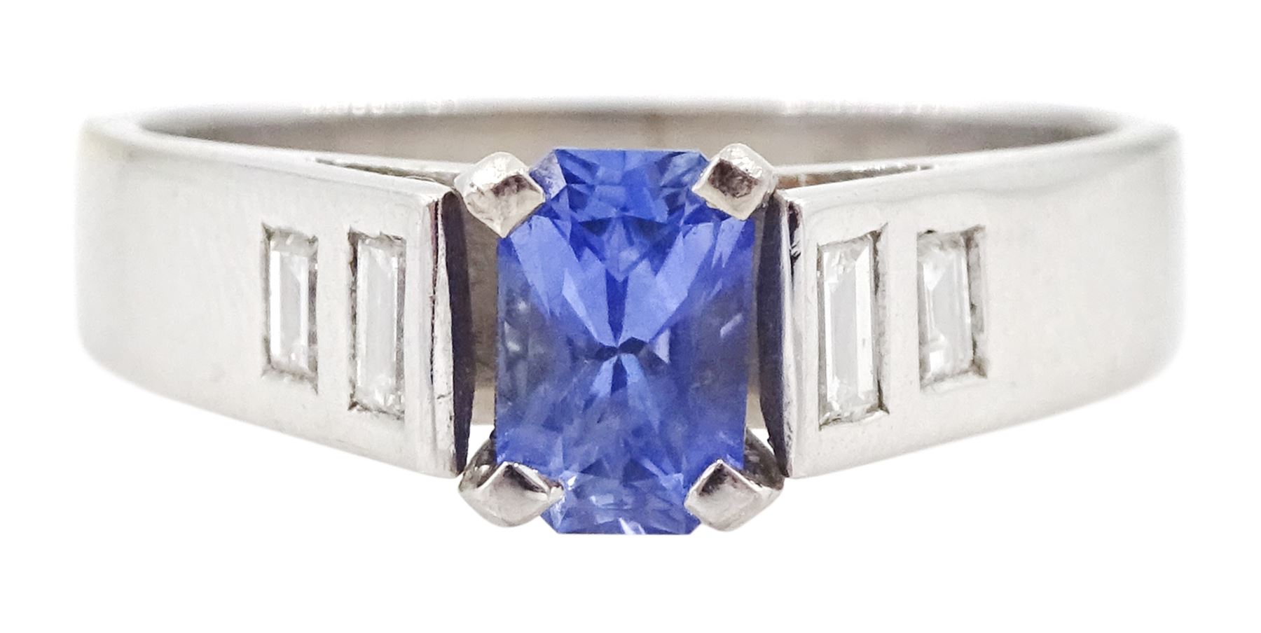 White gold single stone radiant cut sapphire ring, with baguette diamond shoulders, hallmarked 9ct, sapphire approx 0.65 carat