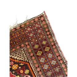 Persian Hamadan dark indigo ground rug, the field decorated with two connected pole medallions, decorated all over with small geometric and stylised bird motifs, geometric design border with repeating pattern 