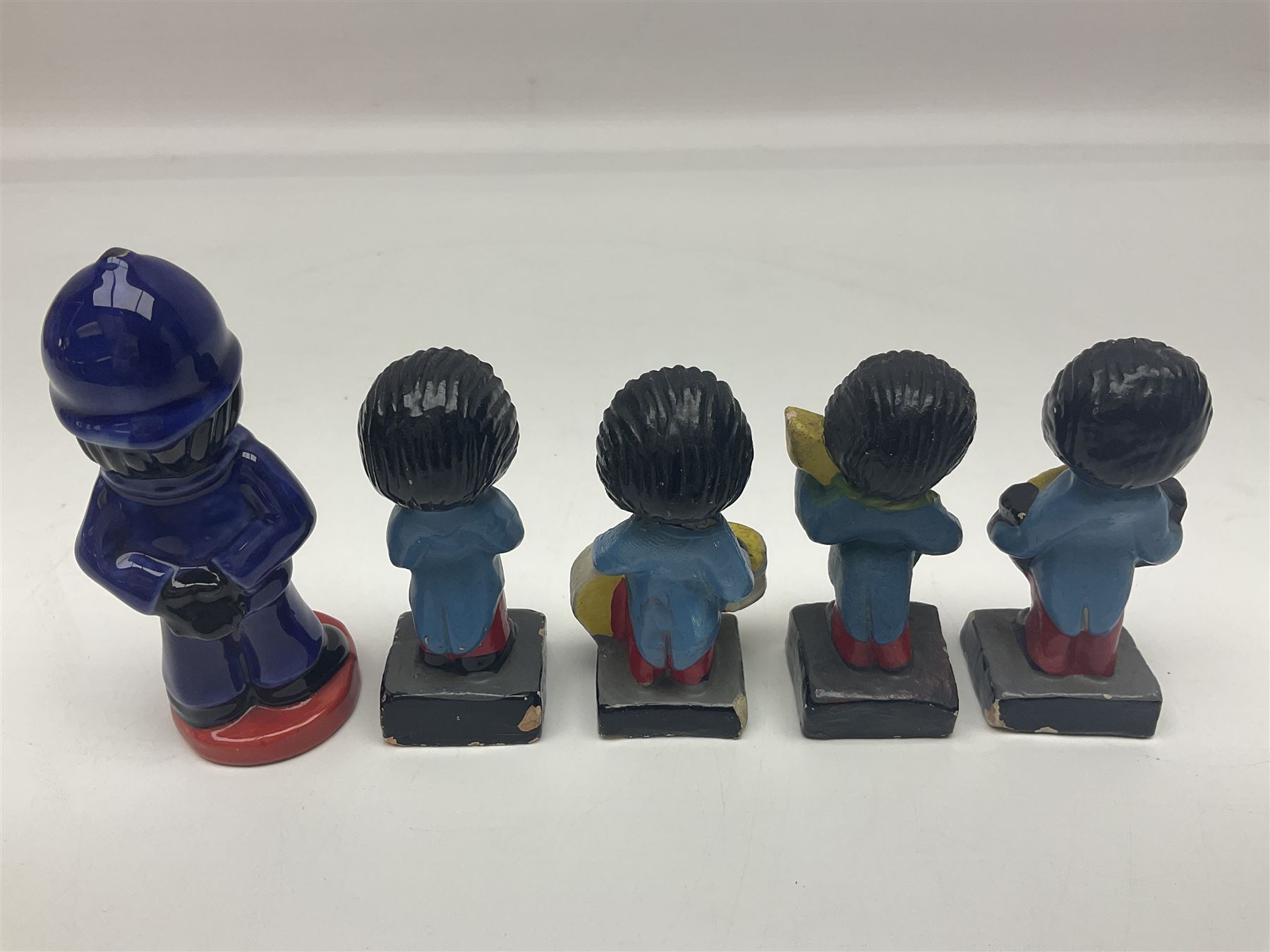 Four Robertson musician golly figures, together with Carlton ware figure etc 