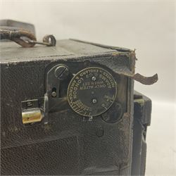 Early 20th century Adams and Co 'Videx' folding plate camera, in original leather carrying case, with various quarter plates