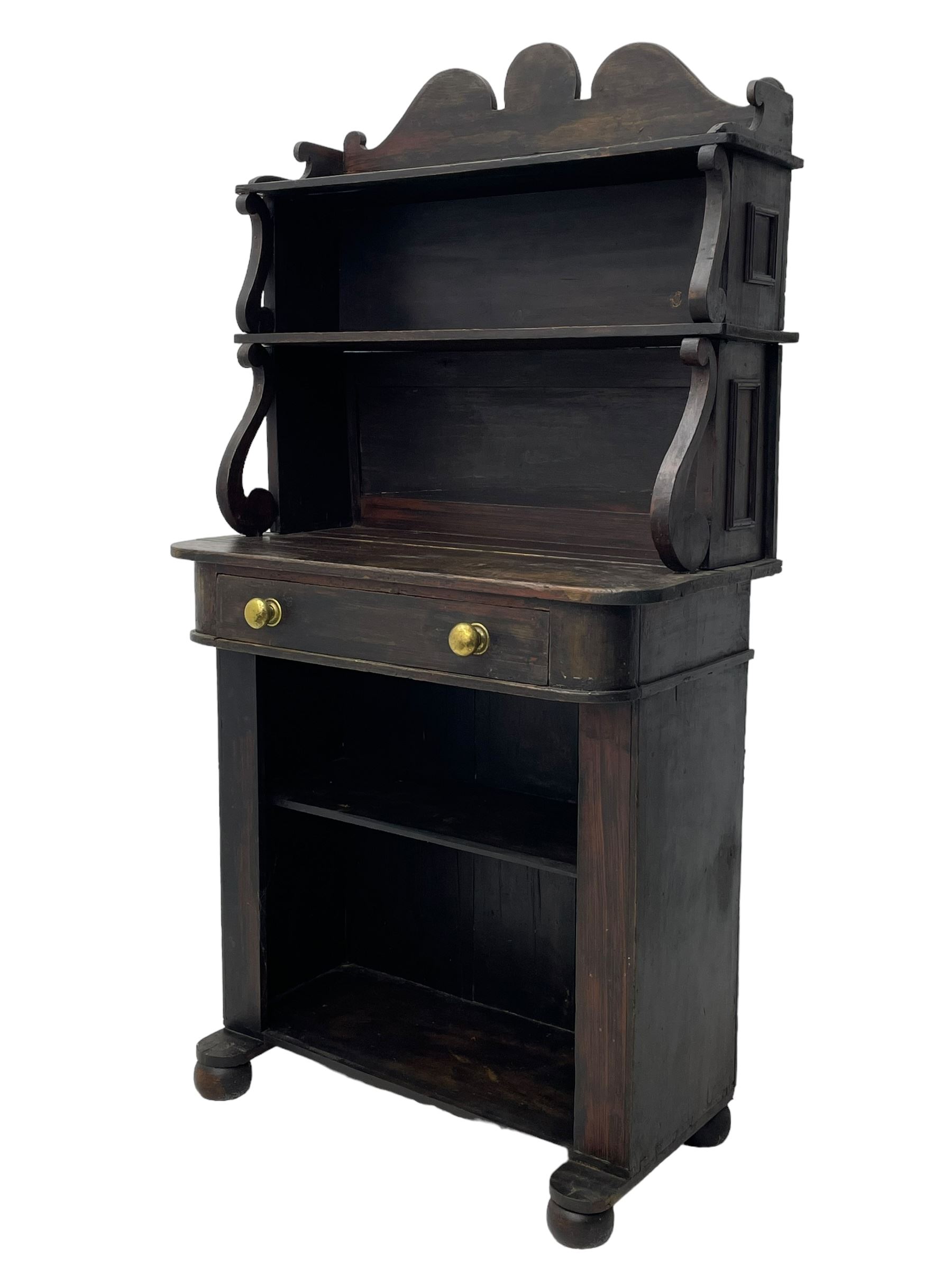 Victorian scumbled pine chiffonier, raised shaped back fitted with two shelves on S-scroll supports, rectangular top with rounded corners over single frieze drawer and open shelf, on projecting rounded sledge platforms and compressed bun feet, scumbled to resemble rosewood 