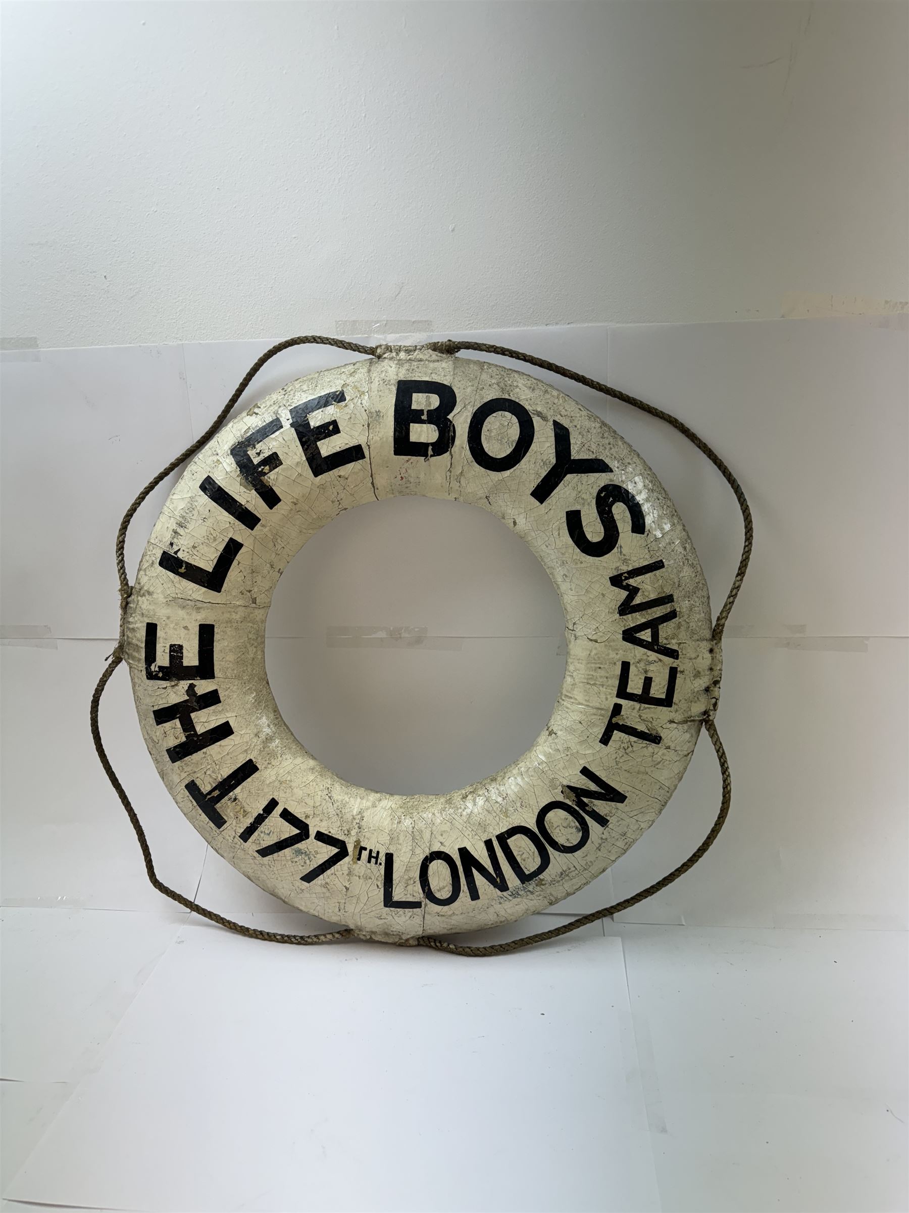 Early 20th century lifebuoy, painted in black lettering 'The Life Boys 177th London Team' upon a white ground, D53cm