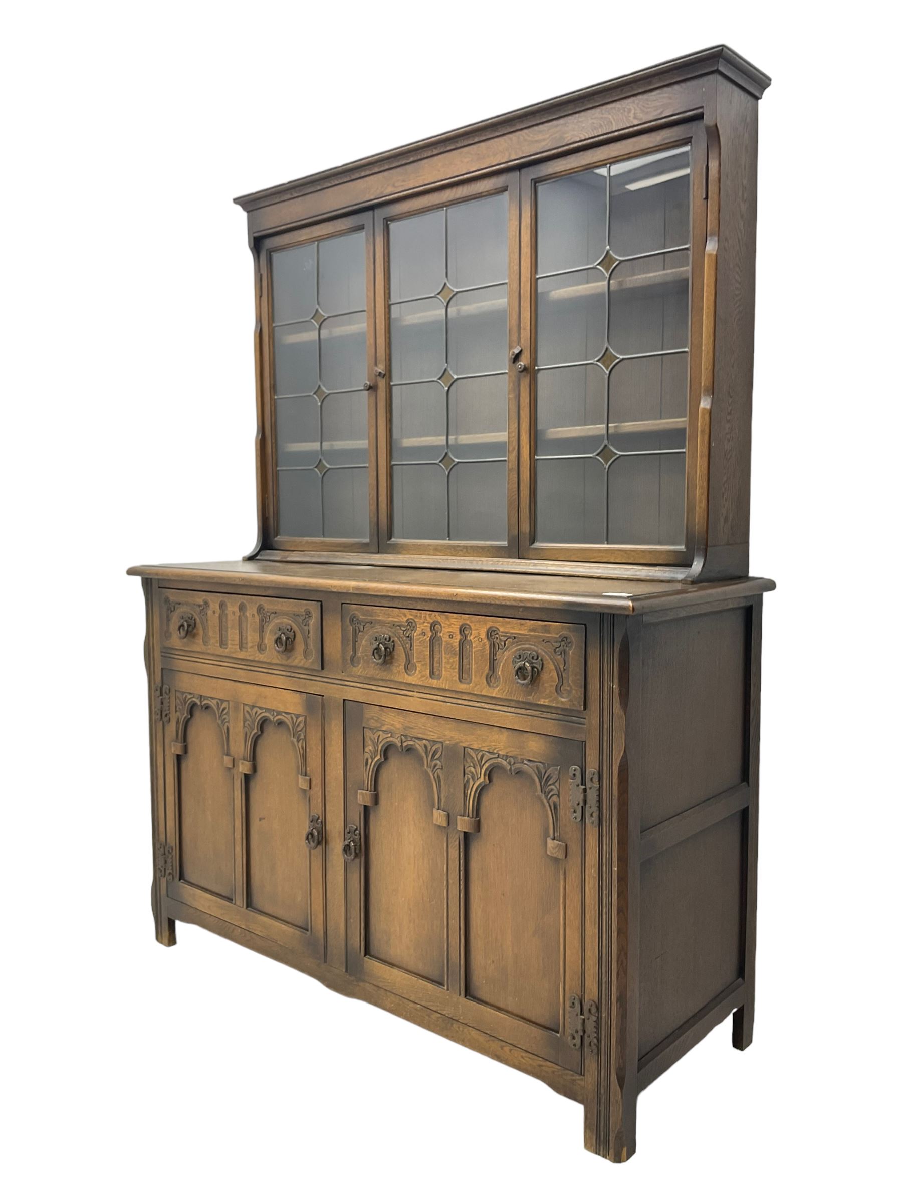 Mid-20th century oak dresser, raised back enclosed by three lead glazed doors, fitted with two drawers and two cupboards