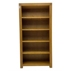 Light oak open bookcase fitted with four shelves 