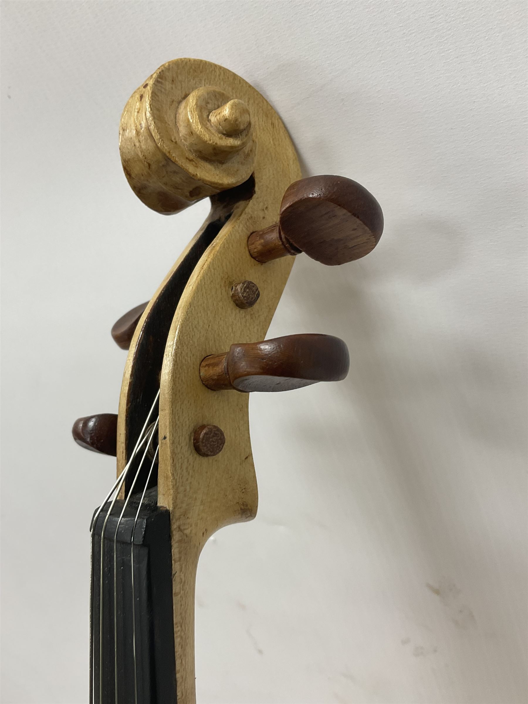 Copy of a full size Stradivarius violin with an ebonised fingerboard and tailpiece, hardwood tuning pegs and chin rest length 60cm