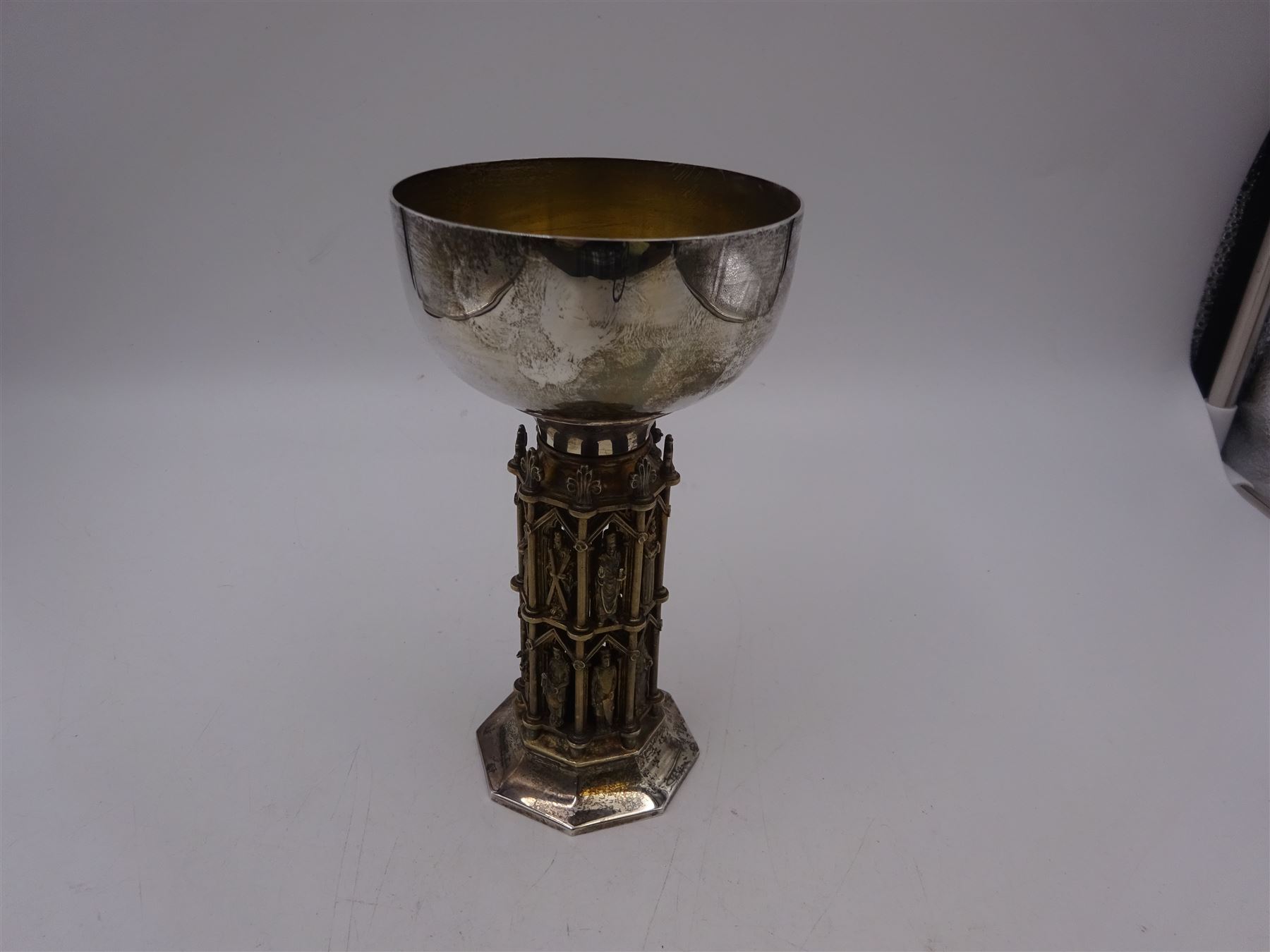 Modern limited edition silver goblet, 'made by order of The Dean and Chapter for the celebration of the eighth centenary of Wells Cathedral in 1982', designed by Hector Miller for Aurum, the plain circular bowl with parcel gilt interior, upon an ornate figural parcel gilt stem and an octagonal foot, no. 80/800, hallmarked Hector Miller, London 1982, H17cm