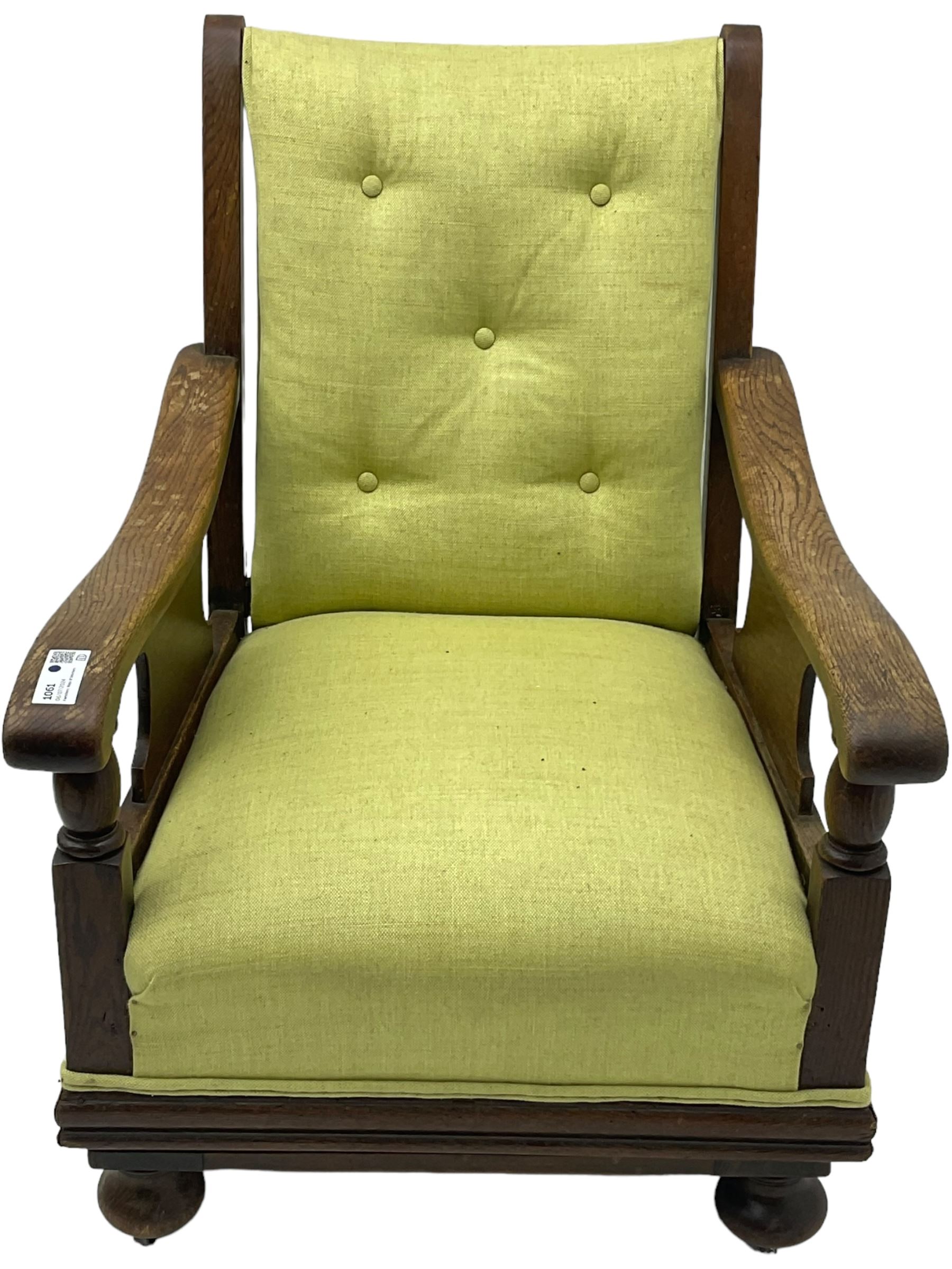 20th century oak framed rocking chair, curved armrests with shaped support panel, upholstered in lime-green fabric with button-tufting on the backrest, concealed springs to facilitate rocking motion underneath, supported by turned front legs with castors