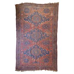 Old Persian red ground flat woven carpet, the field with three large medallions surrounded...