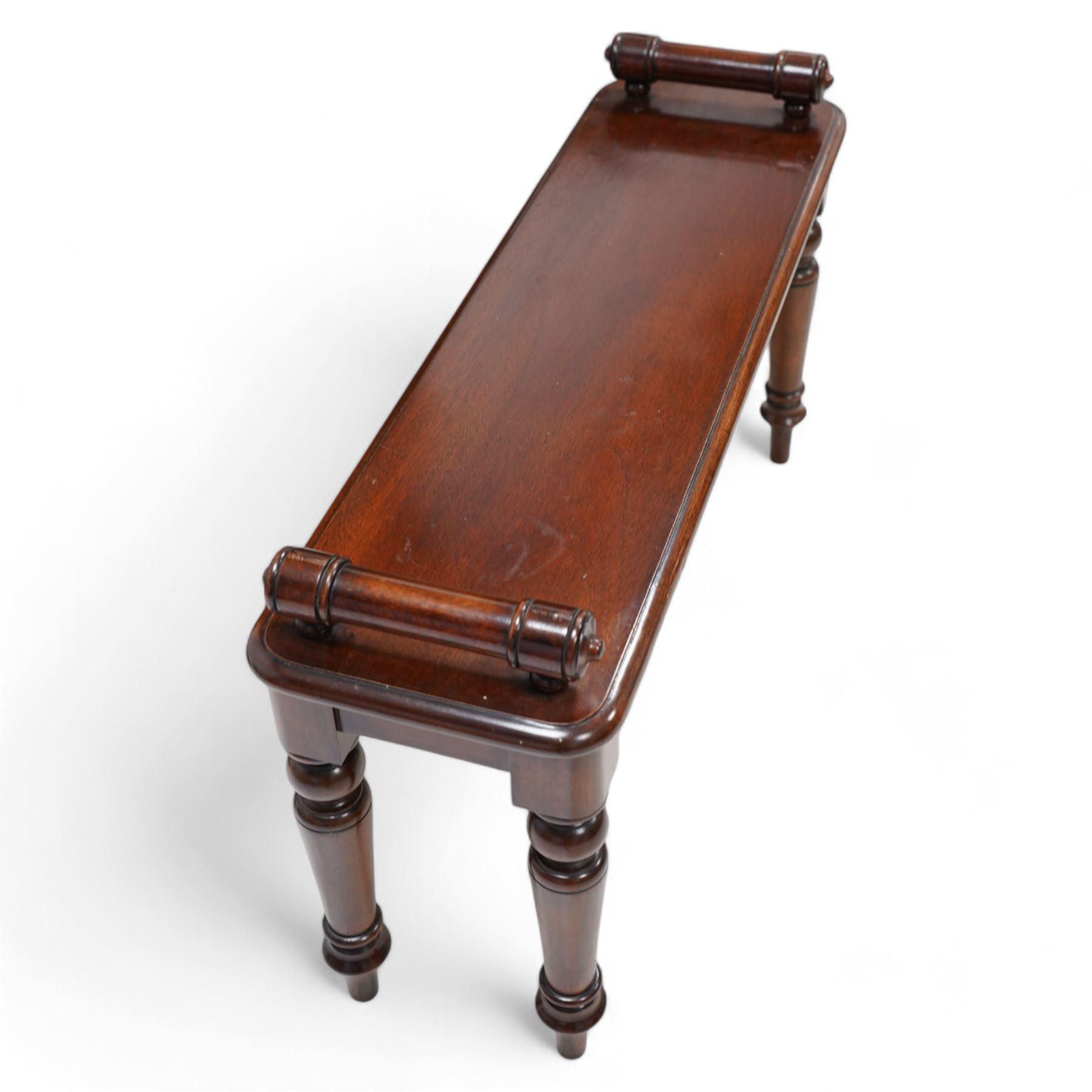 Victorian design mahogany hall bench or window seat, the moulded rectangular top mounted by turned bolster ends, on turned supports