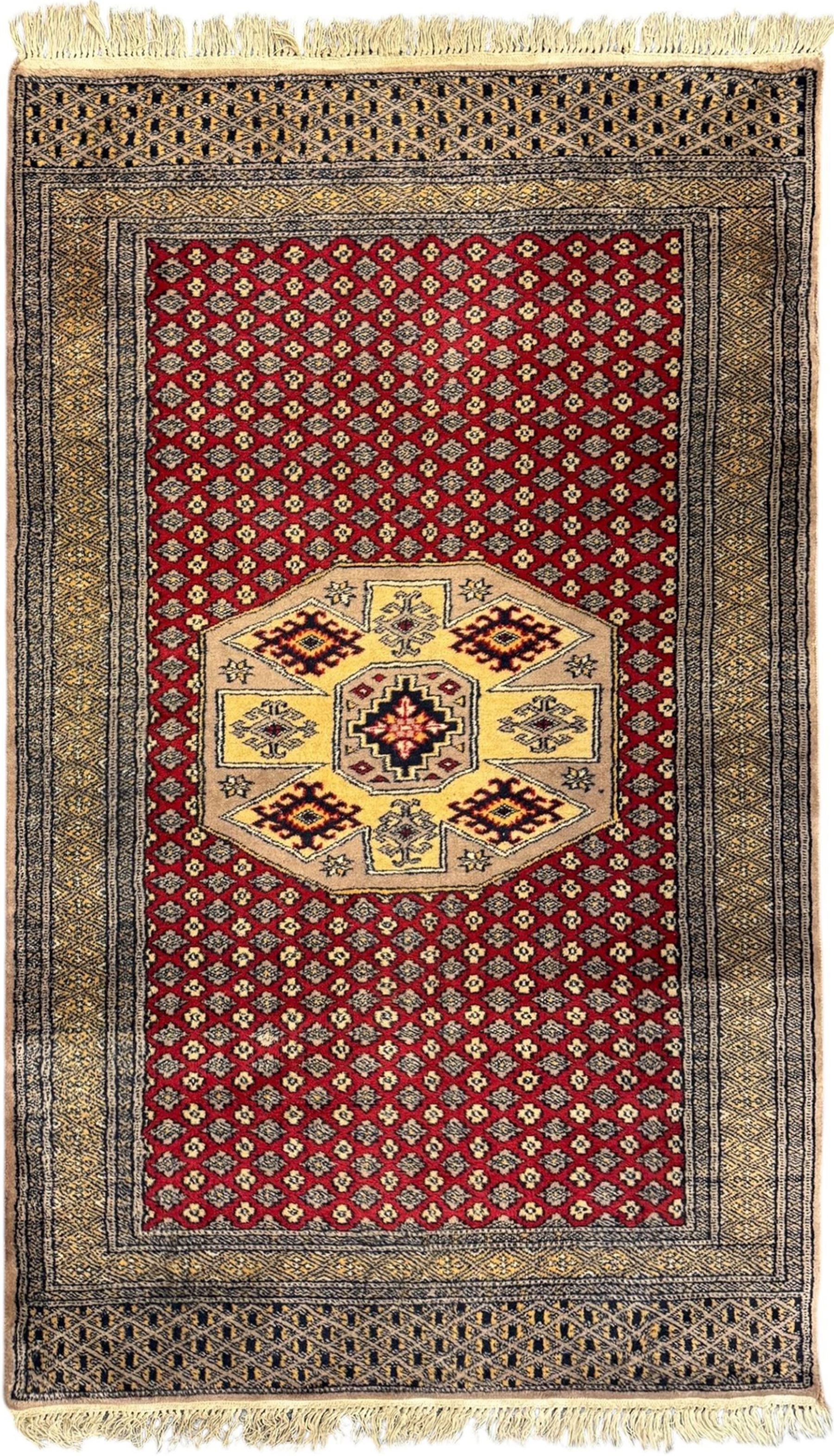 Pakistani Kashan hand-knotted rug with a central medallion and intricate geometric floral patterns, set against a red field and framed by a multi-band border; Pakistani Kashan rug with a repeating floral motif across the red field, enclosed by a detailed geometric border in complementary tones (2)