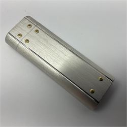 Must de Cartier stainless steel lighter, with gold plated accents, stamped Cartier to base, boxed with guarantee