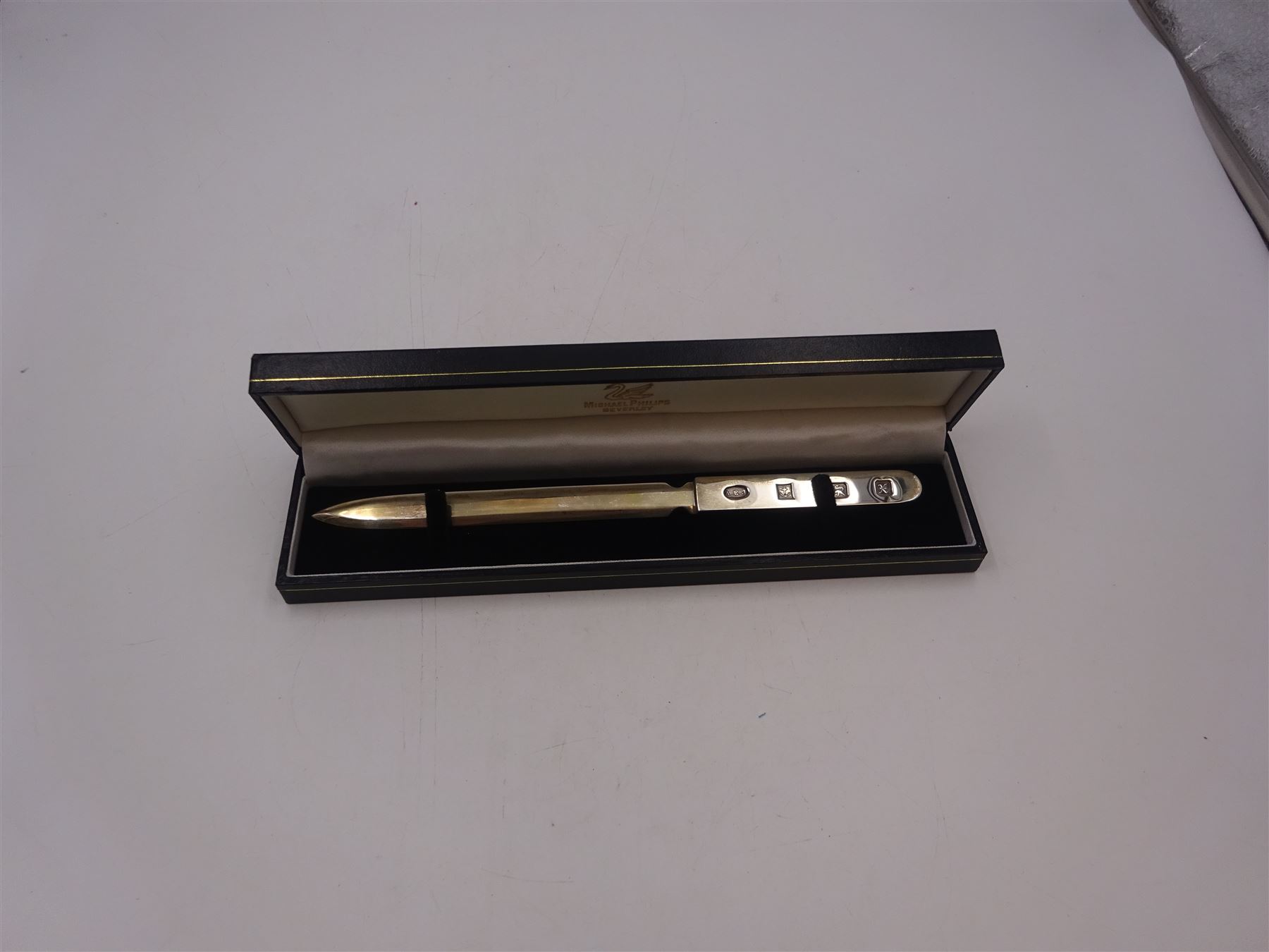 Modern silver letter opener, of plain form with decorative hallmark to handle, hallmarked Albert Edward Jones, Birmingham 1997, boxed