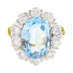 Gold oval cut blue topaz and round brilliant cut diamond cluster ring, stamped 18ct, topaz...